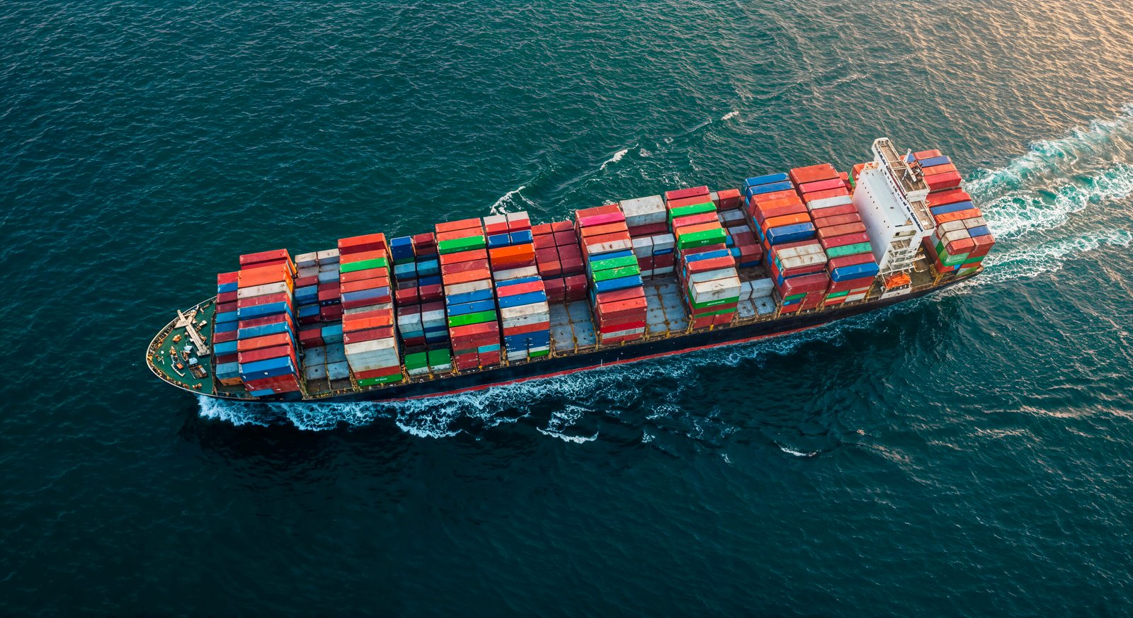 Cargo Ship Carrying Shipping Containers Ocean Scaled